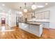 Modern kitchen with island, stainless appliances, and pendant lighting at 2629 Apple Valley Ne Rd, Brookhaven, GA 30319