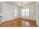 Bright dining room with plantation shutters, hardwood floors and a modern chandelier at 2629 Apple Valley Ne Rd, Brookhaven, GA 30319