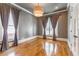 Spacious living room featuring hardwood floors, a modern light fixture, and classic trim details at 2629 Apple Valley Ne Rd, Brookhaven, GA 30319