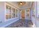 View of the screened in porch with slate tile flooring, ceiling fan, neutral paint and outdoor access at 2629 Apple Valley Ne Rd, Brookhaven, GA 30319