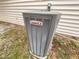 A Lennox Elite air conditioning unit in the backyard of a home with a beige vinyl siding at 3519 Cast Palm Dr, Buford, GA 30519