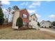 Inviting two-story home with brick and siding, showcasing a front entrance with steps and a well-manicured lawn at 3519 Cast Palm Dr, Buford, GA 30519