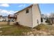 Beige vinyl sided house with a wooden deck and an air conditioning unit in backyard at 3519 Cast Palm Dr, Buford, GA 30519