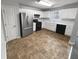 Bright kitchen featuring stainless steel appliances, white cabinets, and durable flooring at 3519 Cast Palm Dr, Buford, GA 30519