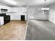 Bright kitchen and dining area featuring white cabinets, black appliances, and natural light from the windows at 3519 Cast Palm Dr, Buford, GA 30519