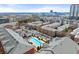 Aerial view of townhomes, pool, landscaping and city skyline in the distance at 4740 Cypress Commons, Atlanta, GA 30338