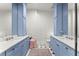 Stylish bathroom featuring blue cabinetry, dual sinks, and marble countertops at 4740 Cypress Commons, Atlanta, GA 30338