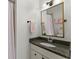 Bathroom featuring a granite countertop, framed mirror and sink at 4740 Cypress Commons, Atlanta, GA 30338