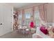 Pink bedroom with a white daybed, plush pillows, and lots of natural light at 4740 Cypress Commons, Atlanta, GA 30338