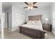 Cozy bedroom with a rustic wooden bed frame, plush bedding, and soft natural light at 4740 Cypress Commons, Atlanta, GA 30338