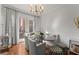 Bright dining area with shiplap walls, modern lighting, and access to a balcony with seating area at 4740 Cypress Commons, Atlanta, GA 30338