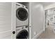 Efficient laundry area with stacked washer and dryer in a closet at 4740 Cypress Commons, Atlanta, GA 30338