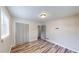 Bedroom with hardwood flooring, a window, and closet at 961 Kingston Nw Rd, Conyers, GA 30012