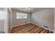 Bedroom with window view and a closet, featuring updated flooring at 961 Kingston Nw Rd, Conyers, GA 30012