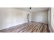 Bright living room featuring wood-look floors and modern lighting at 961 Kingston Nw Rd, Conyers, GA 30012