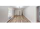 Bright, airy living area with wood-look flooring and neutral walls at 961 Kingston Nw Rd, Conyers, GA 30012