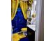 Colorful bathroom with a vibrant shower curtain, creative storage, and coordinated accents at 2761 Trebek Ct, Mcdonough, GA 30253