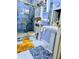 Bright bathroom featuring a glass shower, uniquely decorated walls, and marble floors at 2761 Trebek Ct, Mcdonough, GA 30253