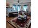 Comfortable bedroom with ornate bed, accent pillows, sitting area, and decorative rug at 2761 Trebek Ct, Mcdonough, GA 30253