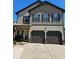 Charming two-story home featuring a two-car garage and welcoming front porch at 2761 Trebek Ct, Mcdonough, GA 30253