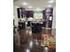 Spacious kitchen featuring dark cabinets, a center island with seating, and modern appliances at 2761 Trebek Ct, Mcdonough, GA 30253