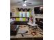 Cozy living room features stylish decor, sectional seating, and a floral patterned rug at 2761 Trebek Ct, Mcdonough, GA 30253