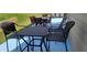 Outdoor patio area furnished with a dining set and chairs at 2761 Trebek Ct, Mcdonough, GA 30253