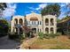 Stunning two-story stucco home featuring arched balconies and a beautifully landscaped front yard at 856 Briarcliff Ne Rd # 21, Atlanta, GA 30306