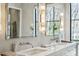 This bathroom features a double vanity, granite countertops, and modern lighting at 100 Tuxedo Nw Ter, Atlanta, GA 30342