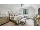 This bedroom features a comfortable bed, ample lighting, and hardwood floors at 100 Tuxedo Nw Ter, Atlanta, GA 30342
