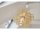 Striking geometric chandelier adding a modern touch to the home's interior with large, open design at 100 Tuxedo Nw Ter, Atlanta, GA 30342