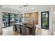 Dining room with natural light, featuring modern art and seating for ten guests at 100 Tuxedo Nw Ter, Atlanta, GA 30342