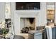 Stylish fireplace featuring a herringbone design, flanked by modern art and decor at 100 Tuxedo Nw Ter, Atlanta, GA 30342