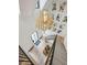 This foyer has a modern light fixture, curved staircase, and hardwood floors at 100 Tuxedo Nw Ter, Atlanta, GA 30342
