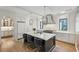 Beautiful kitchen with a large island, stainless steel appliances, custom cabinetry, and modern lighting at 100 Tuxedo Nw Ter, Atlanta, GA 30342
