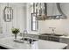 Close-up of kitchen island featuring a sink, modern faucet, and stylish pendant lighting at 100 Tuxedo Nw Ter, Atlanta, GA 30342