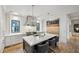 Spacious kitchen with a central island, stainless steel range hood, and hardwood flooring at 100 Tuxedo Nw Ter, Atlanta, GA 30342