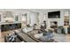 Expansive living room featuring a fireplace, modern furnishings, and open floor plan at 100 Tuxedo Nw Ter, Atlanta, GA 30342