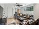 This living room features modern decor, a large couch, and a ceiling fan at 100 Tuxedo Nw Ter, Atlanta, GA 30342
