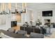 Open living space with fireplace, modern furnishings, and view of kitchen at 100 Tuxedo Nw Ter, Atlanta, GA 30342