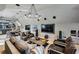 Open concept living room featuring bright neutral paint, hardwood flooring, and a large bar area at 100 Tuxedo Nw Ter, Atlanta, GA 30342