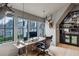 The office has a built-in bar, hardwood floors, and many windows offering great natural light at 100 Tuxedo Nw Ter, Atlanta, GA 30342