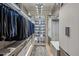 This walk-in closet has custom shelving, ample storage, and recessed lighting at 100 Tuxedo Nw Ter, Atlanta, GA 30342