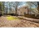 Expansive backyard surrounded by mature trees, enhancing privacy and outdoor enjoyment at 1394 Meadow Springs Dr, Lilburn, GA 30047