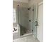 Modern walk-in shower featuring a rain shower head and an adjustable shower head at 1394 Meadow Springs Dr, Lilburn, GA 30047