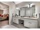 Dual sink bathroom featuring granite countertops and plenty of cabinet storage at 1394 Meadow Springs Dr, Lilburn, GA 30047