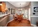 Bright breakfast nook with bay window, wood floors and a chandelier at 1394 Meadow Springs Dr, Lilburn, GA 30047