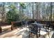 The backyard deck features a table and chairs, ideal for relaxing or entertaining outdoors at 1394 Meadow Springs Dr, Lilburn, GA 30047