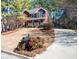 Beautiful two-story red brick home featuring a manicured lawn and a long driveway at 1394 Meadow Springs Dr, Lilburn, GA 30047