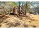 Traditional brick home exterior with mature trees on a landscaped lot at 1394 Meadow Springs Dr, Lilburn, GA 30047